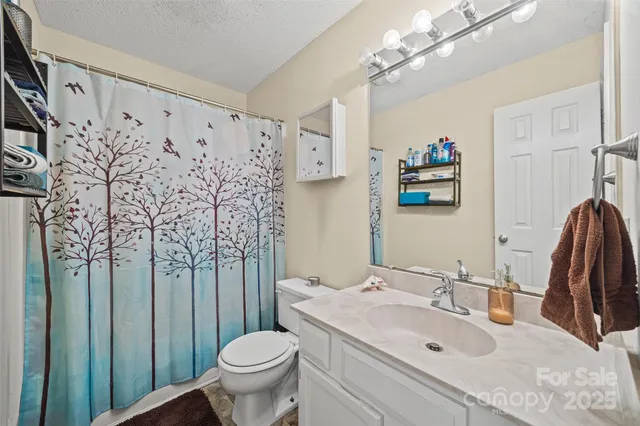 a view of a small yard with wooden fence