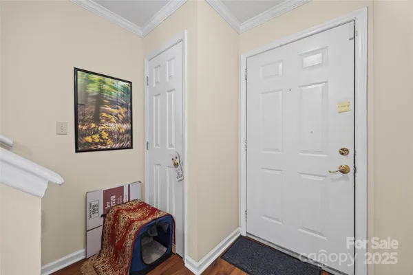 a view of room with closet and wooden floor