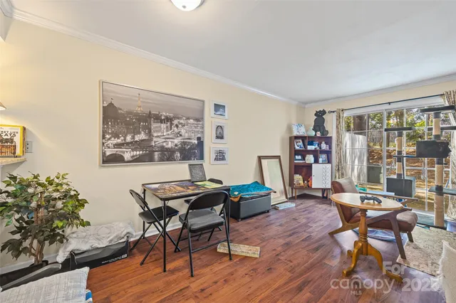 a workspace with furniture window and wooden floor