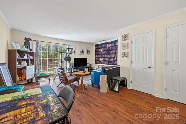 a view of a livingroom with furniture and a flat screen tv