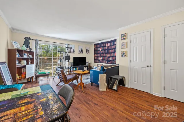 a view of a livingroom with furniture and a flat screen tv