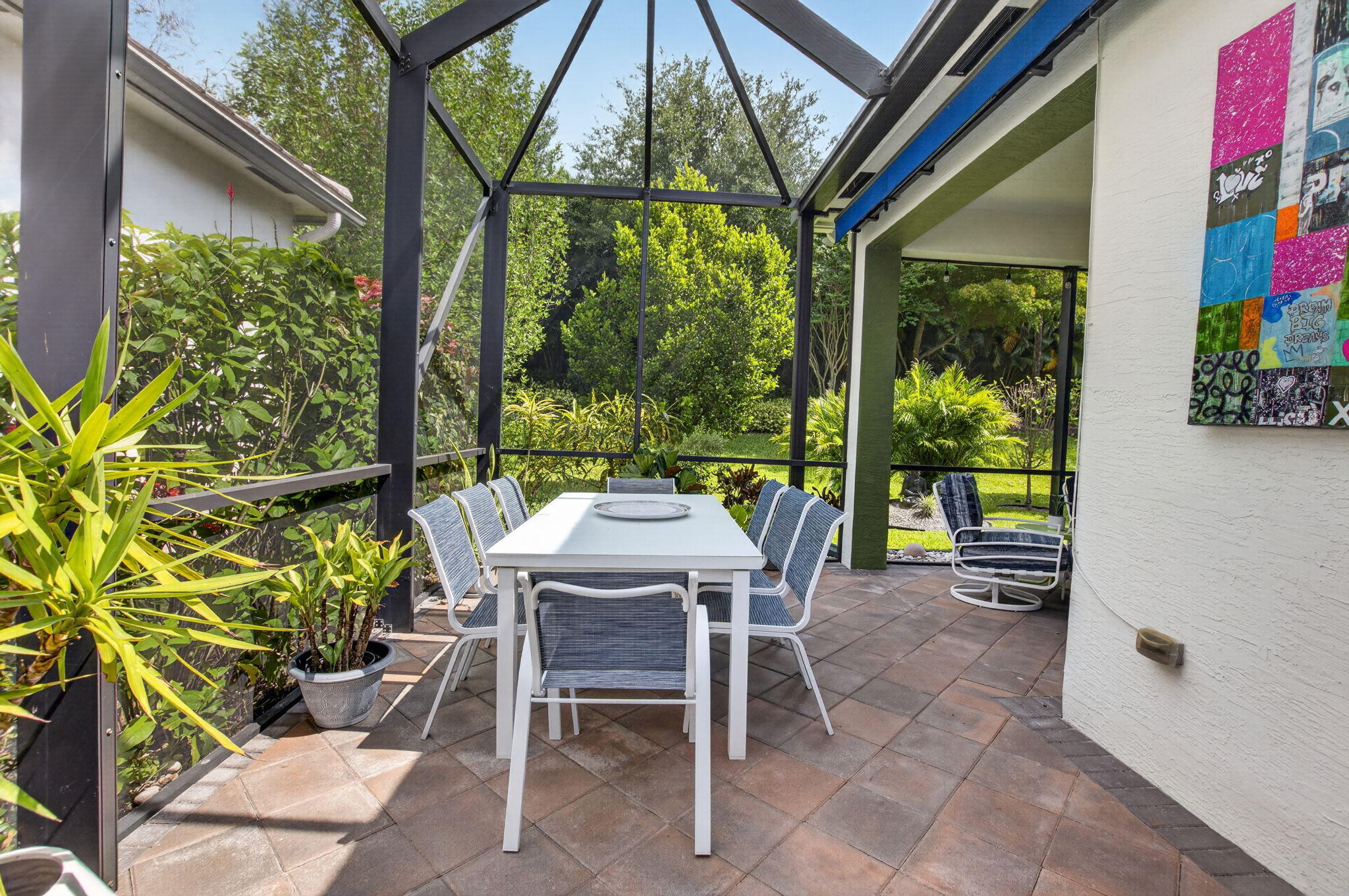 8263 Arabian Range Road Boynton Beach, FL 33473 - Photo 6 of 52 a dining room with furniture and garden view