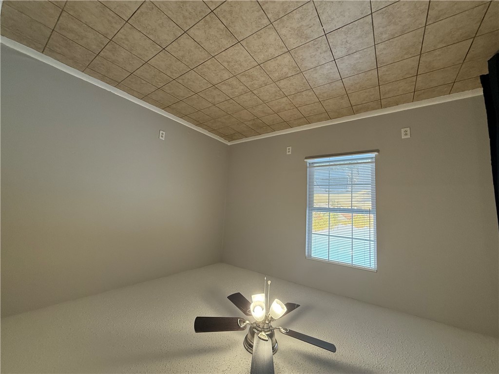2000 Kazmeier, Unit 29 Bryan, TX 77802 - Photo 7 of 11 an empty room with windows and fan