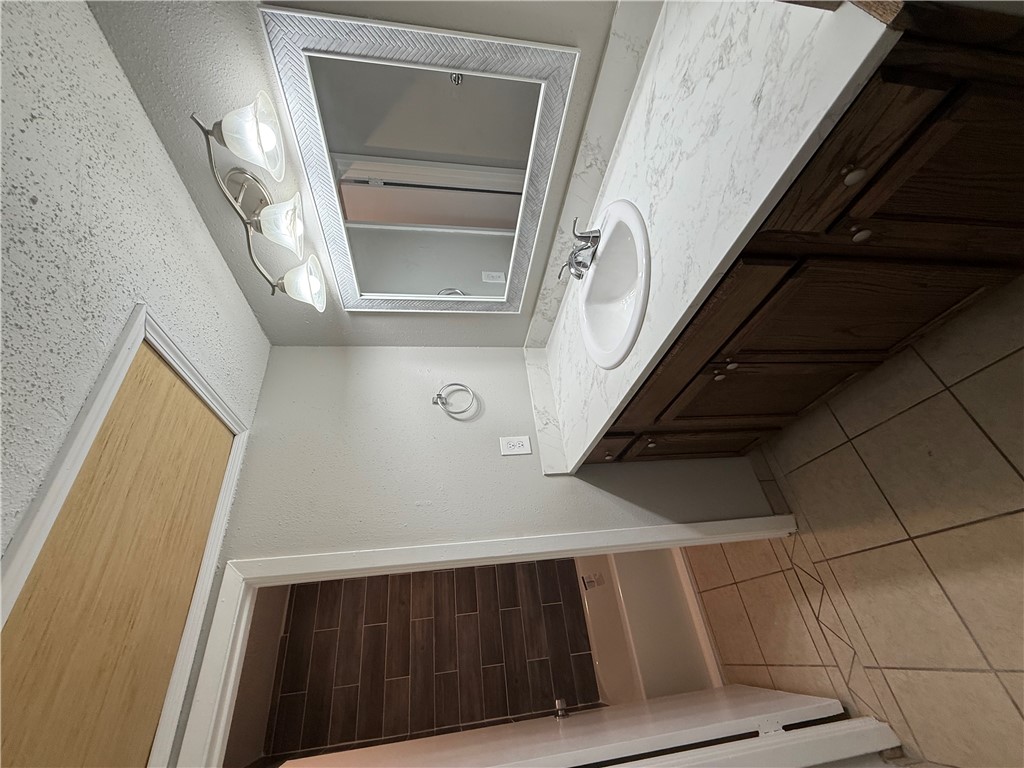 2000 Kazmeier, Unit 29 Bryan, TX 77802 - Photo 8 of 11 a bathroom with a sink and a mirror