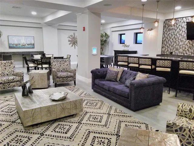 a cabinet with a white wall and a large window