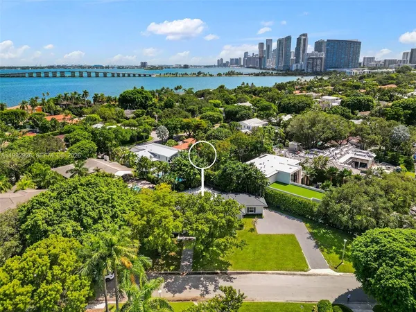a view of house that has a yard