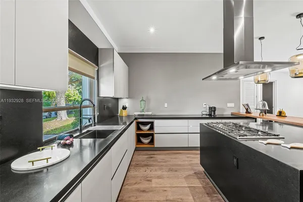 a workspace with wooden floor and a fireplace