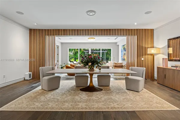 a living room with a large window and a table