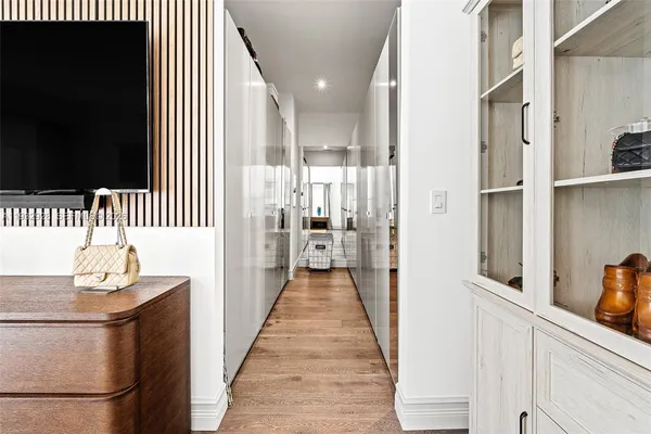 a bedroom with a large bed and a large window