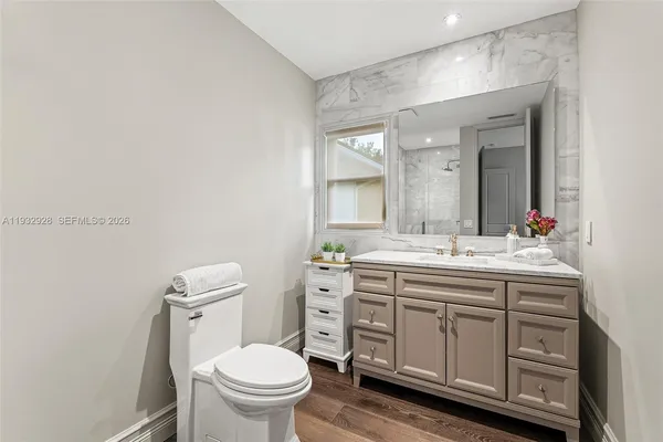 a view of a swimming pool with a patio and a yard