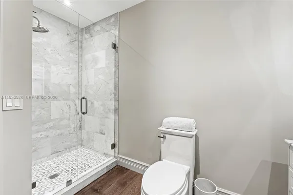 an aerial view of a houses with a yard