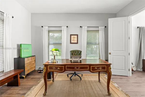 a bedroom with bed and window