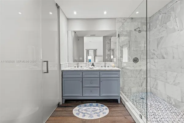 a spacious bedroom with a bed and a large window