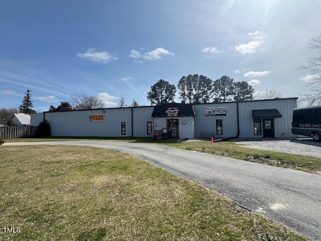 851 Erwin Road Dunn, NC 28334 - Photo 1 of 12 a view of a house with a backyard
