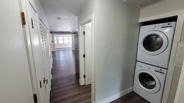 a view of a hallway with washer and dryer