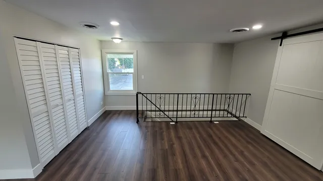 a view of entryway with wooden floor