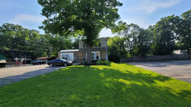 a view of a backyard with sitting area