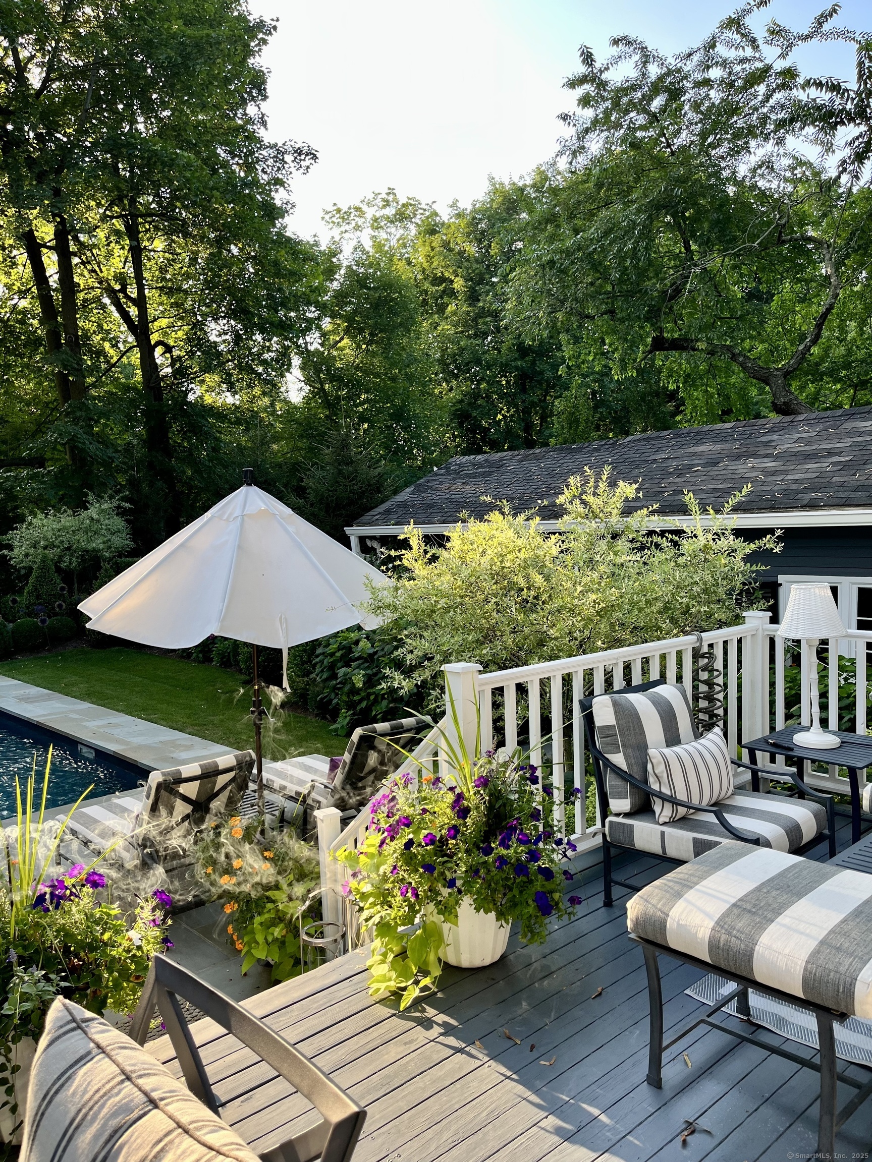 233 Rowayton Avenue Norwalk, CT 06853 - Photo 32 of 33 a view of a patio with furniture and umbrella
