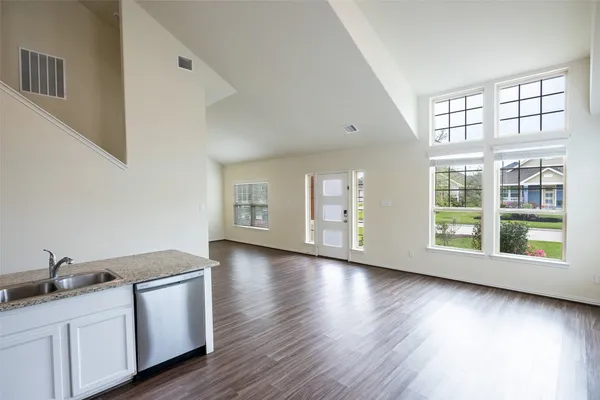 a kitchen with sink and cabinets