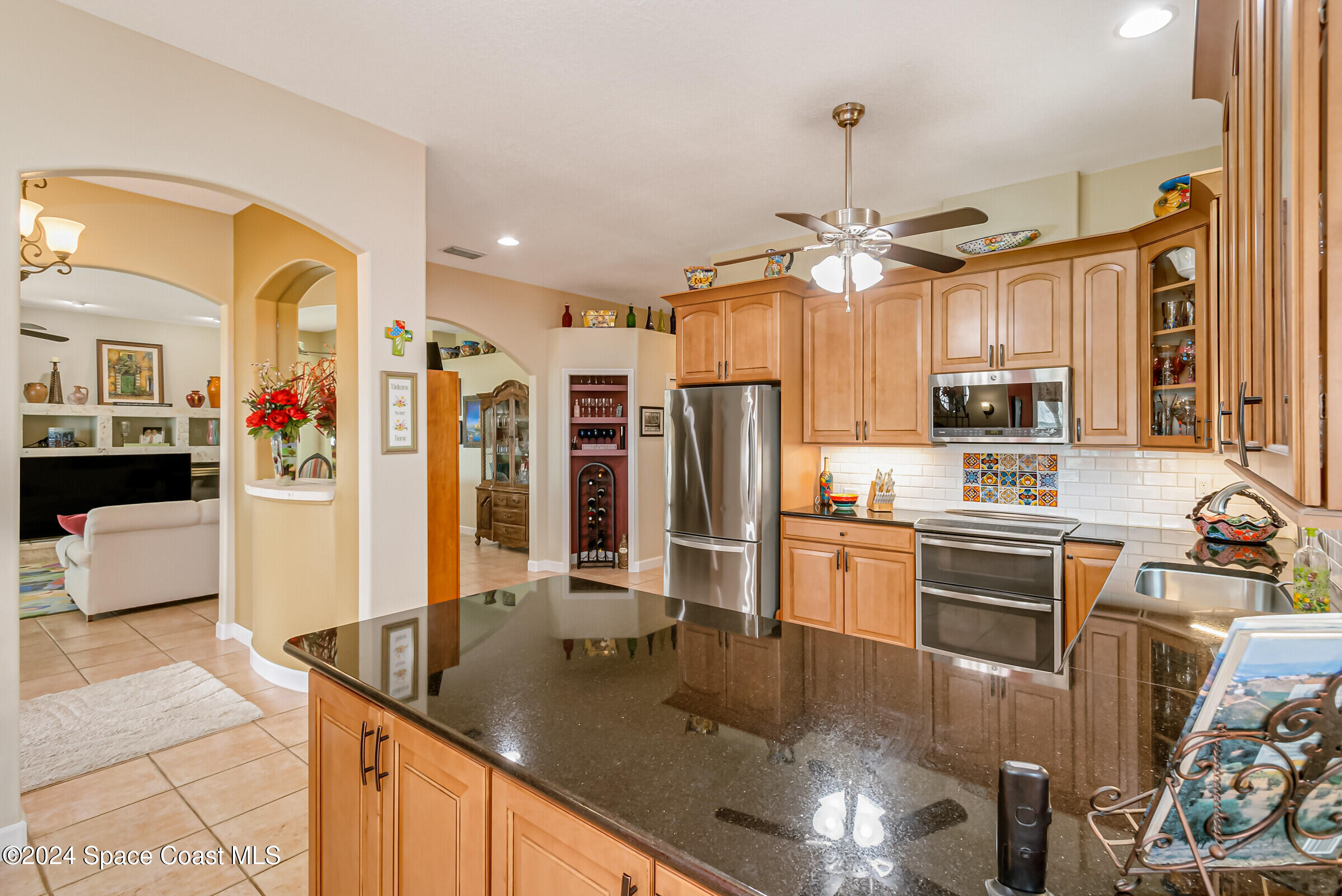 1829 Rockledge Drive Rockledge, FL 32955 - Photo 13 of 53 a kitchen with stainless steel appliances granite countertop a sink refrigerator and cabinets