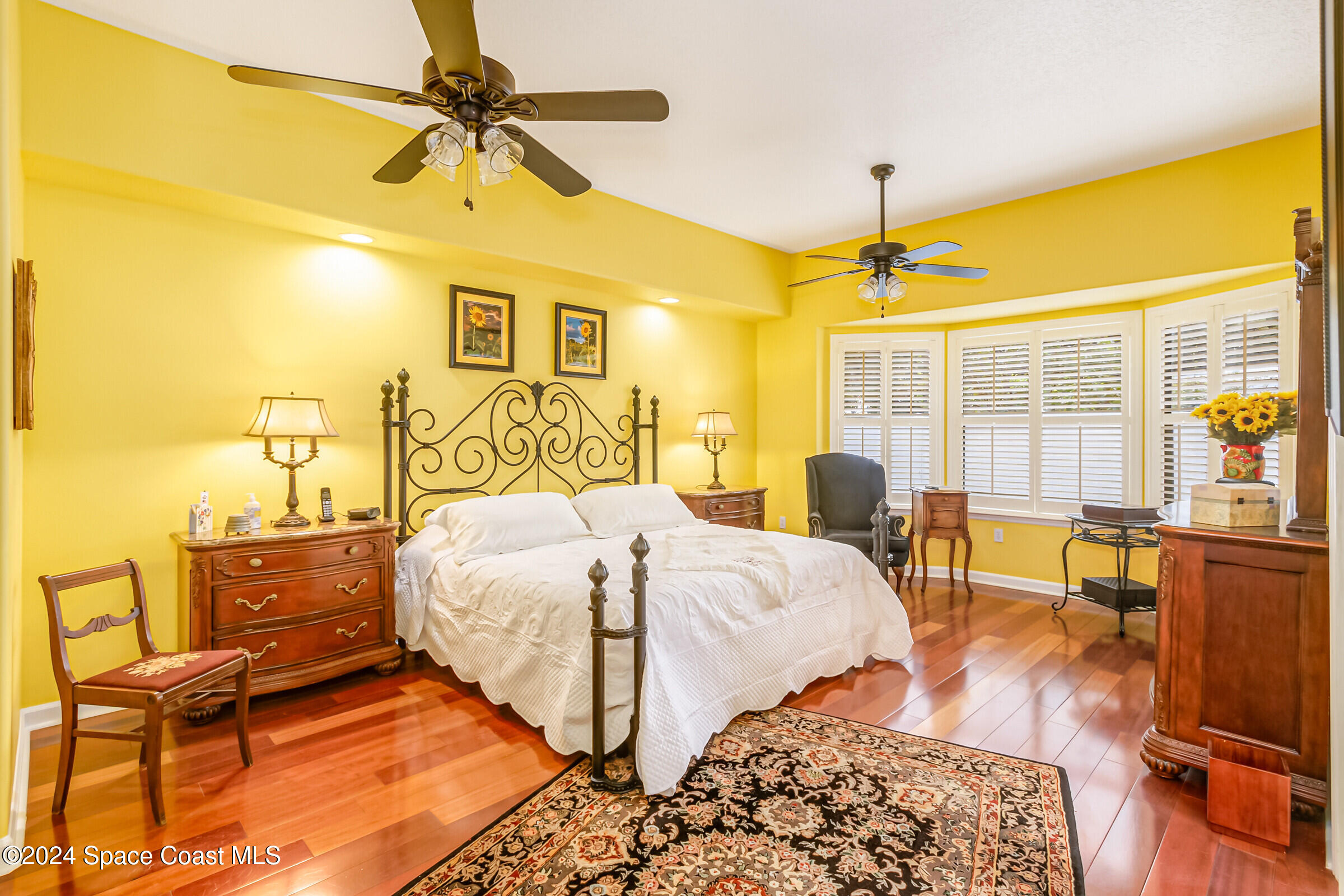 1829 Rockledge Drive Rockledge, FL 32955 - Photo 17 of 53 a bedroom with a bed and wooden floor