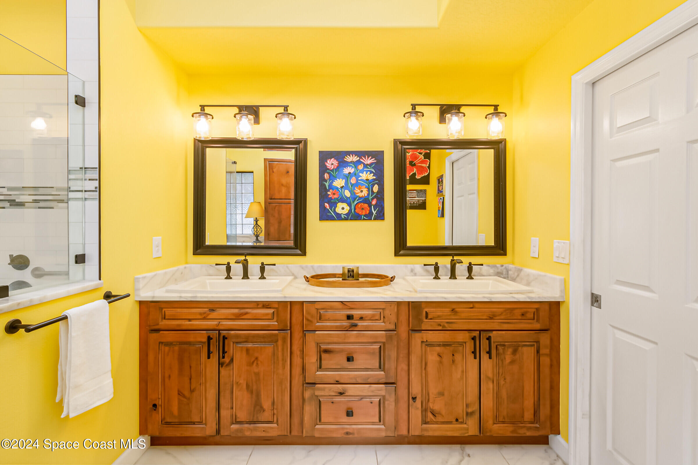 1829 Rockledge Drive Rockledge, FL 32955 - Photo 20 of 53 a bathroom with a granite countertop double vanity sink a mirror and a shower