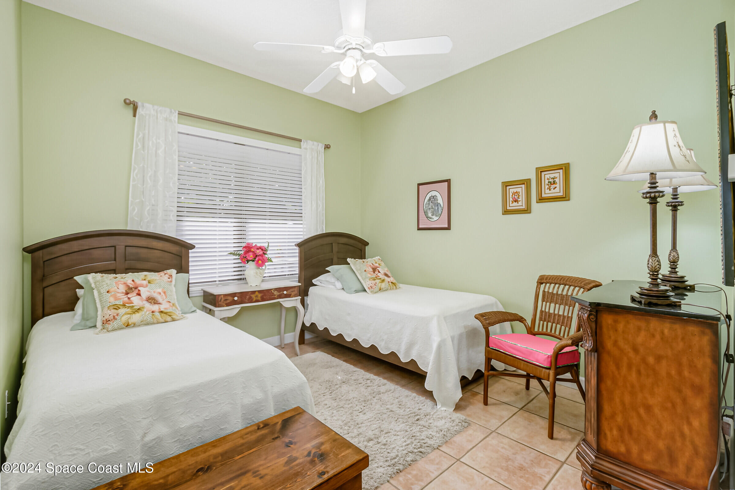 1829 Rockledge Drive Rockledge, FL 32955 - Photo 25 of 53 a bedroom with two beds and a chandelier