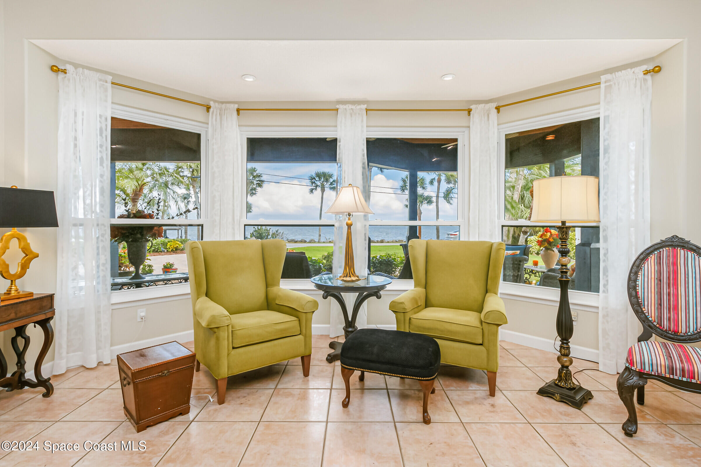 1829 Rockledge Drive Rockledge, FL 32955 - Photo 9 of 53 a living room with furniture and a window