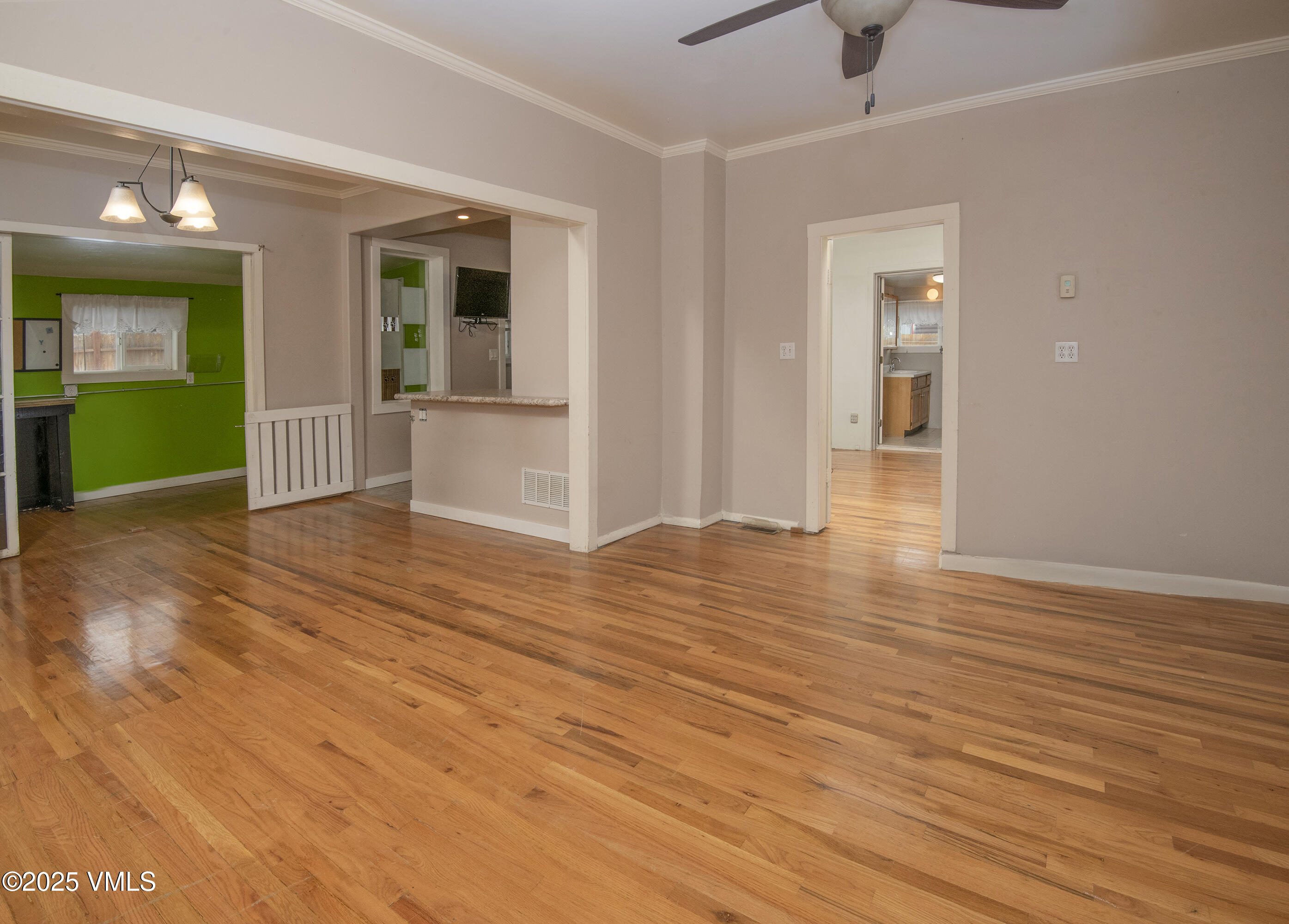 432 West 5th Street Eagle, CO 81631 - Photo 19 of 27 a view of an empty room with wooden floor and a bathroom