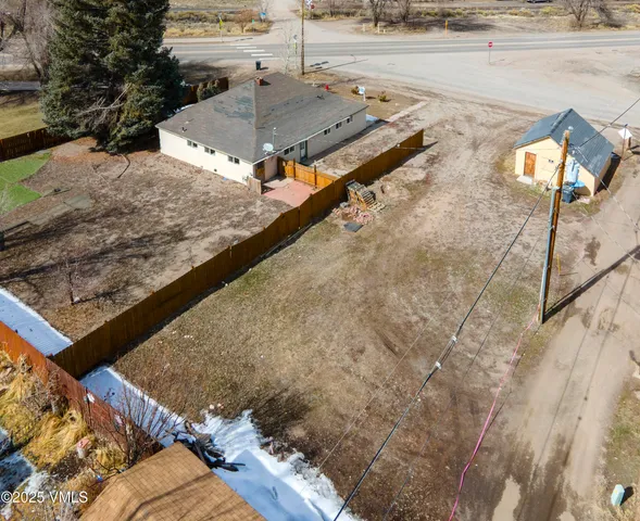 an aerial view of a house with outdoor space