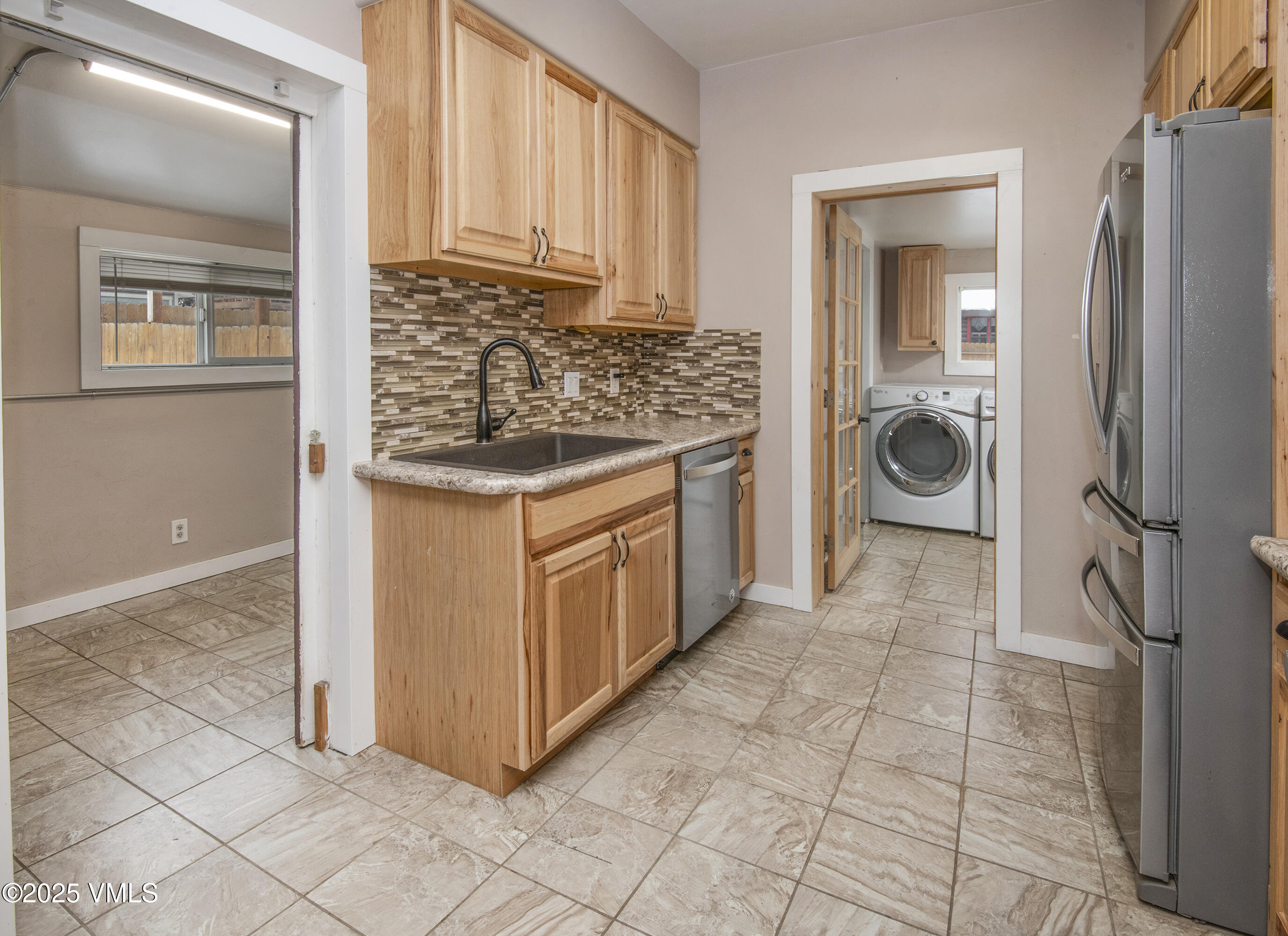 432 West 5th Street Eagle, CO 81631 - Photo 6 of 27 a kitchen with stainless steel appliances granite countertop a stove and a refrigerator