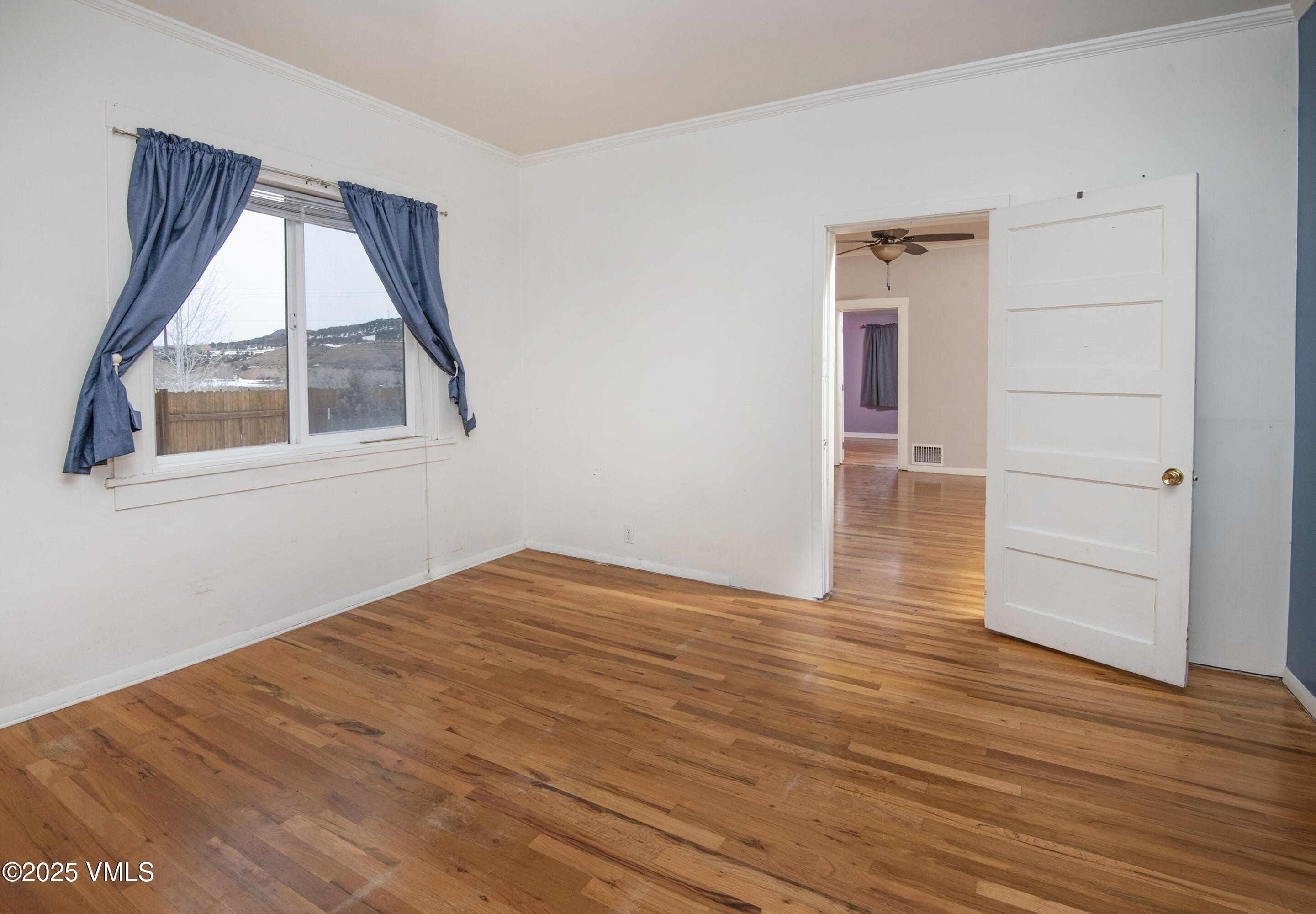 432 West 5th Street Eagle, CO 81631 - Photo 10 of 27 an empty room with wooden floor and windows