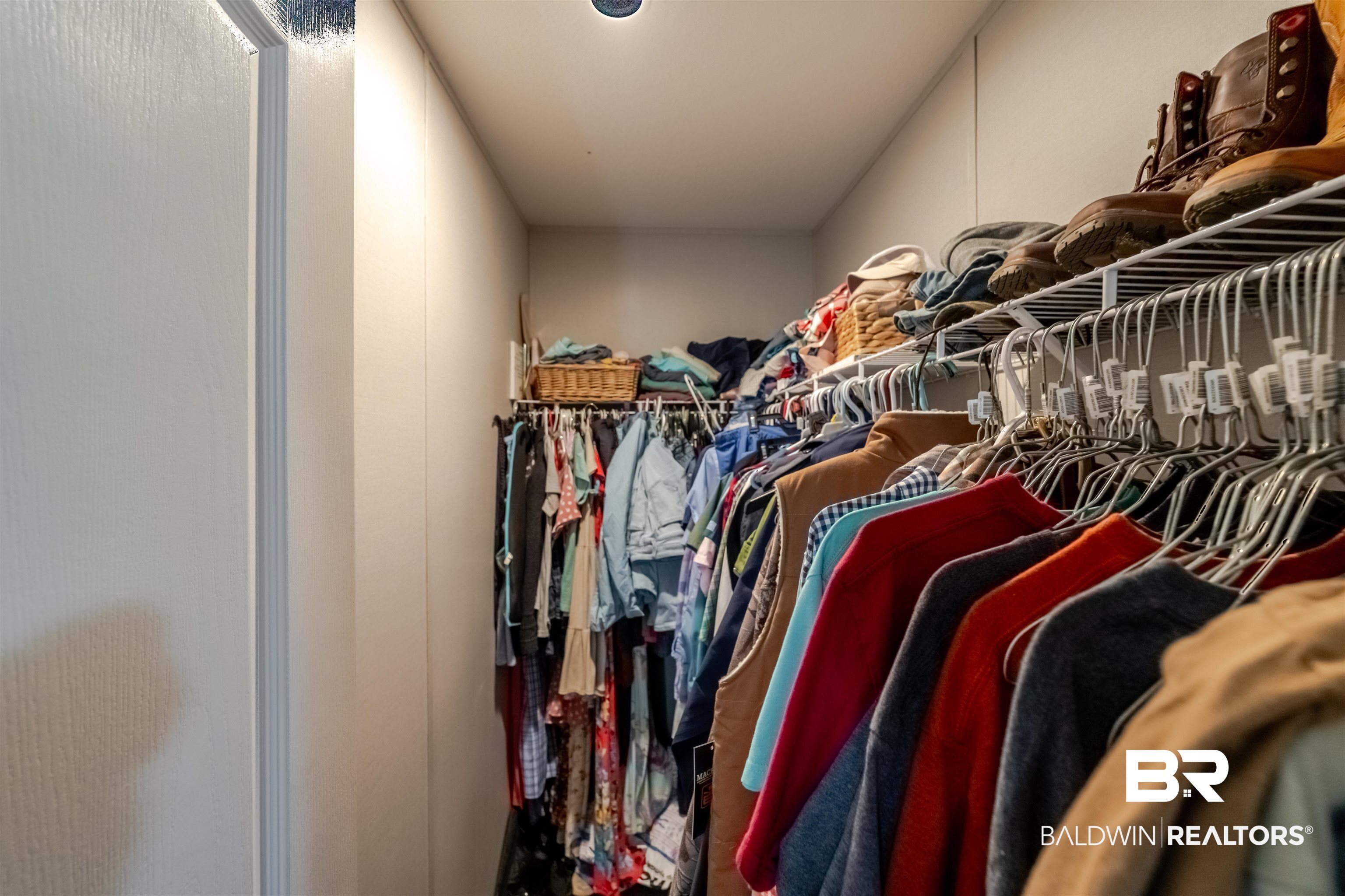 15575 Mikkelsen Road Summerdale, AL 36580 - Photo 17 of 68 Walk-in closet featuring built-in wire shelving and hanging rods
