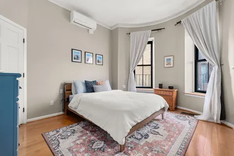 a bed room with a bed and a window