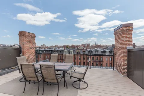 a view of a terrace with furniture