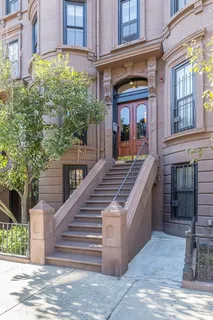 a view of a brick building with many windows