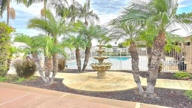 a view of a house with backyard and porch