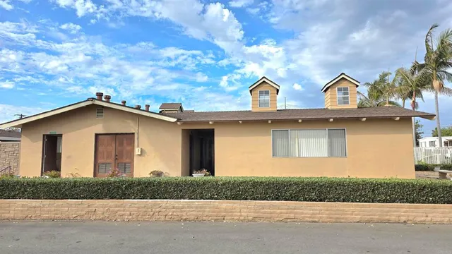 a bathroom with a sink a washer and dryer