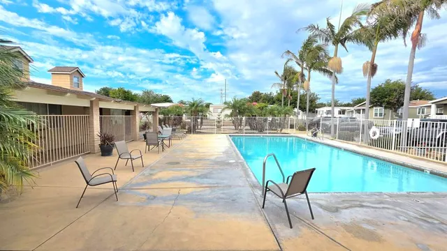 a swimming pool with outdoor seating yard and balcony
