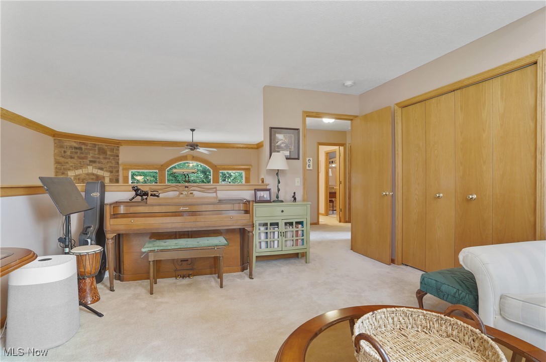 4265 Ridge Crest Drive Akron, OH 44321 - Photo 27 of 49 Sitting room with light colored carpet and ceiling fan