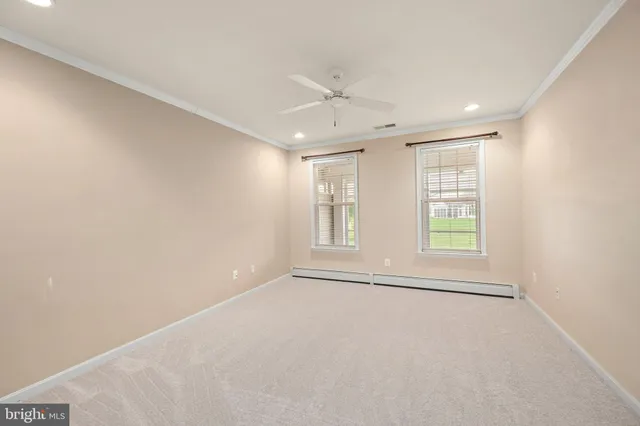 a bathroom with a tub a sink and mirror
