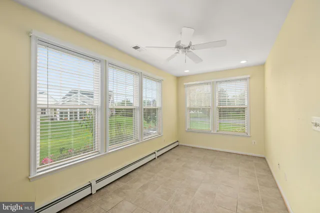 a view of a garden with a building in the background