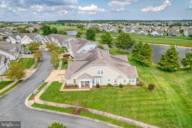 an aerial view of residential house with outdoor space and river