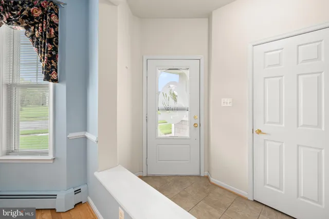 wooden floor in an empty room with a fireplace