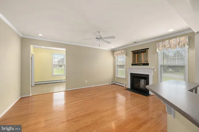 a view of a kitchen with a sink and a fireplace