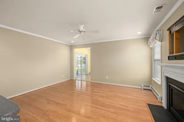 a kitchen with stainless steel appliances granite countertop a stove a sink a refrigerator and a microwave