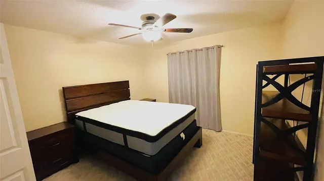 a room that has a bed and a table in it