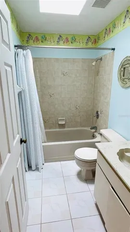 a bathroom with a sink a toilet and bathtub