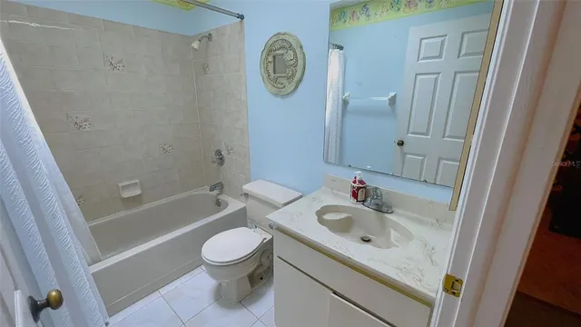 a bathroom with a sink a toilet and a bathtub