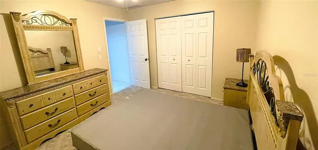 a view of a bathroom with a tub and a mirror